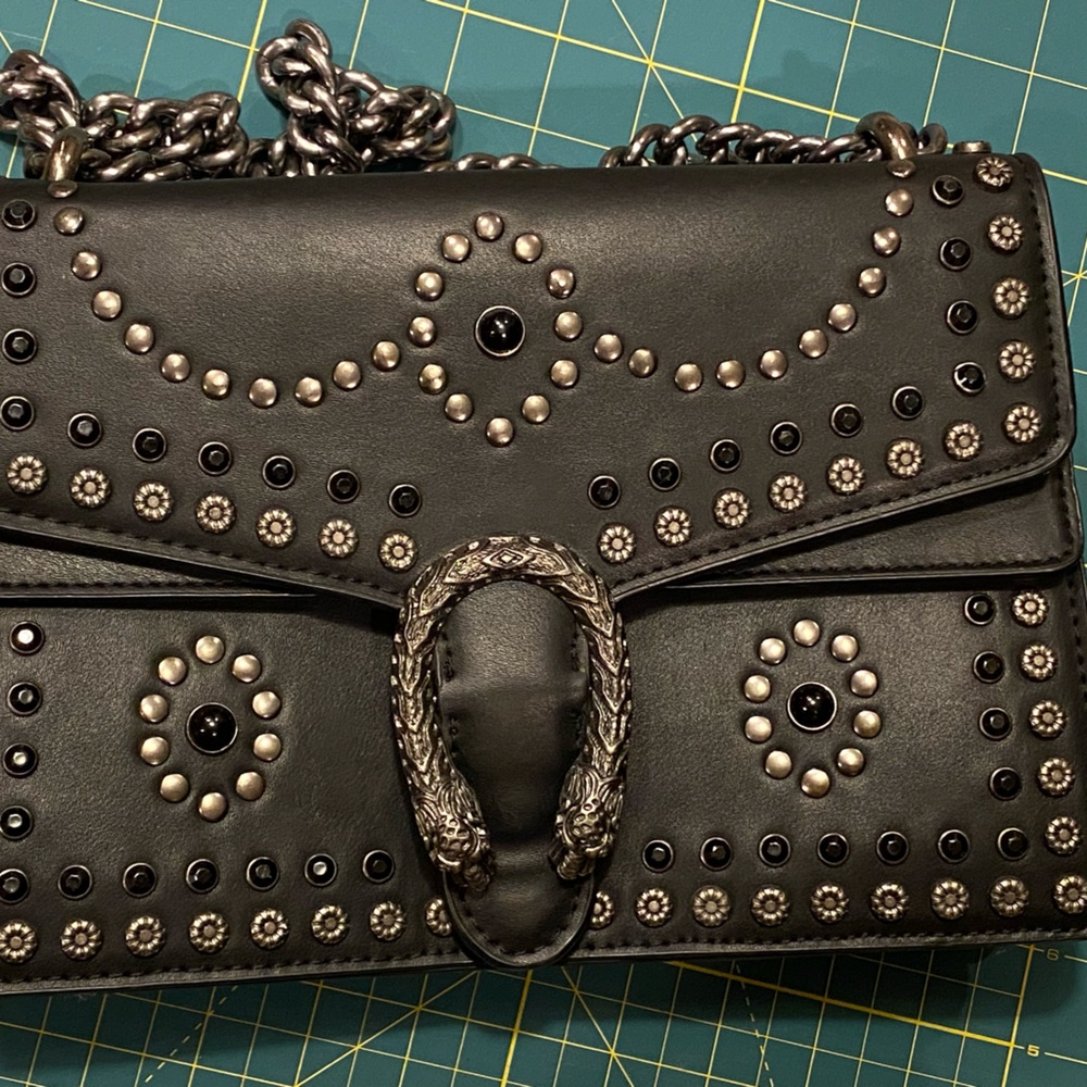 Studded beautiful Black Clutch metal chain handles.